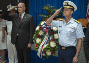 Maritime Administrator Paul "Chip" Jaenichen, left, and VADM Charles D. Michel, Coast Guard deputy commandant for Operations, salute during wreath-laying at the annual National Maritime Day celebration at Dept. of Transportation headquarters in Washington- May 21.
