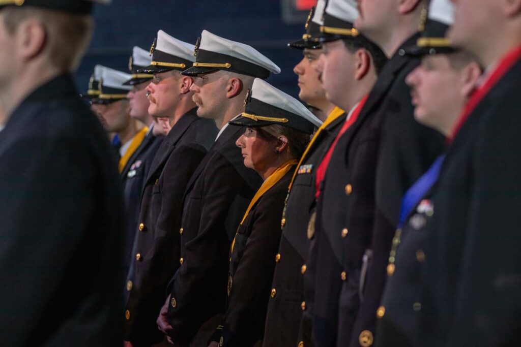 Maine Maritime Academy graduates stand at attention at the spring Commencement ceremony, May 3, 2025. (Image Credit: Maine Maritime Academy)