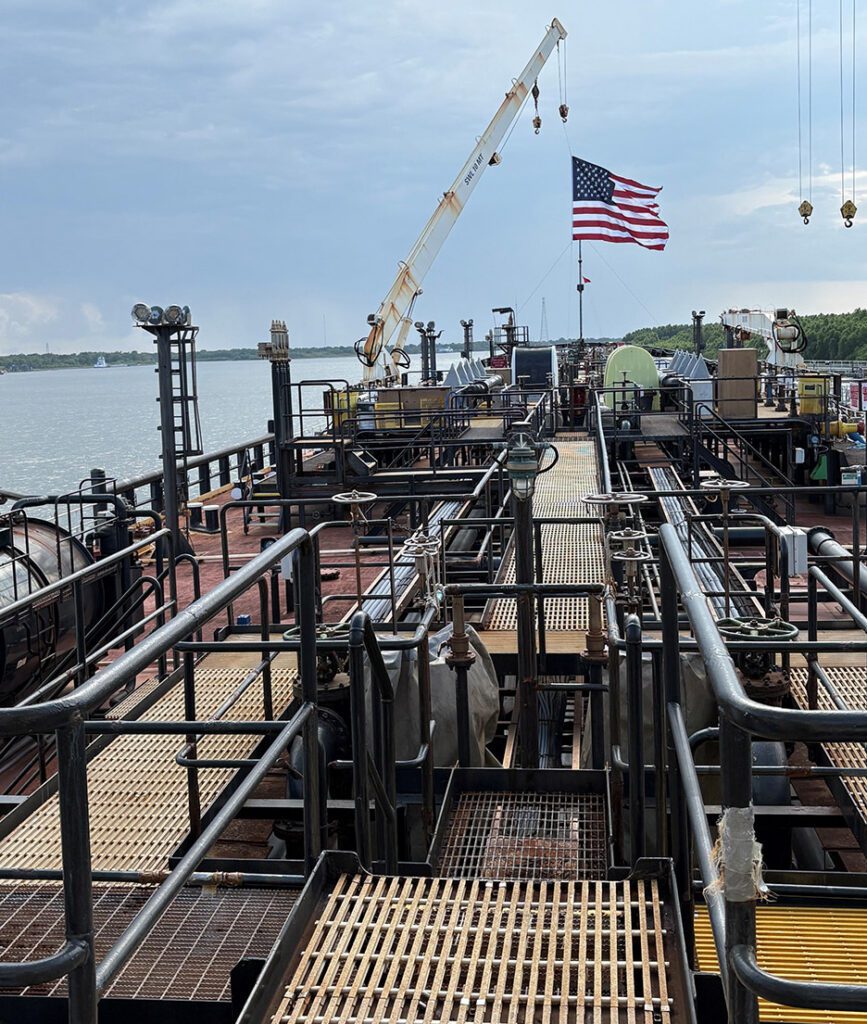 In support of the Jones Act, the Stars and Stripes flies above the SIU-crewed ATB Courage/650-5 (Fairwater) along the Mississippi (Image Credit: Seafarers International Union)